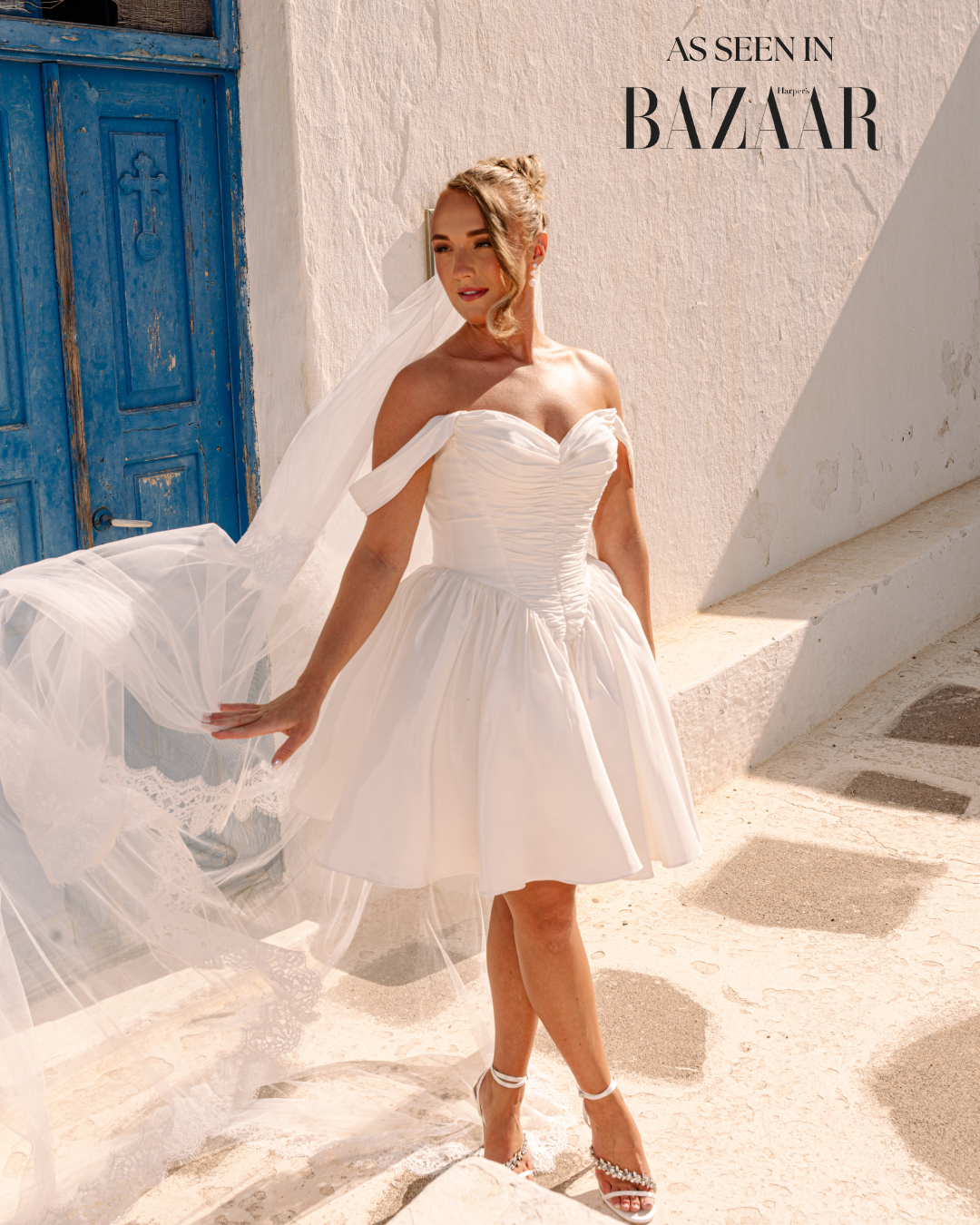 The Hera Dress by Aurelle Attire, romantic short bridal dress with detachable straps and flowing skirt, photographed in Santorini.