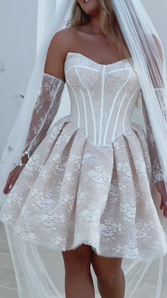 Flowing mini skirt of Clio Bridal Reception Dress with layered tulle and glitter lace, capturing the dress's ethereal movement.